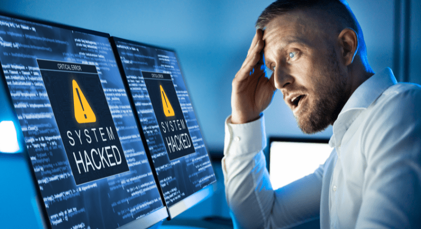 What is data breach | CyberArrow A guy sitting infront of desktop screen witnessing data breach